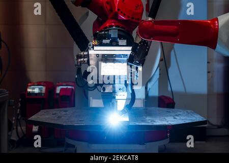Close-up of automated robot welding metal in factory Stock Photo