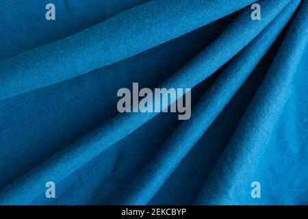 Blue fabric knitwear in a fold. Texture, background Stock Photo