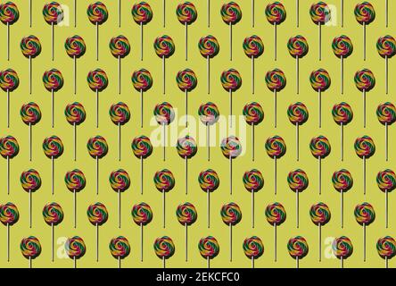 Pattern of multi colored lollipops against yellow background Stock Photo