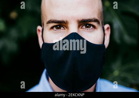 Young man wearing protective mask Stock Photo