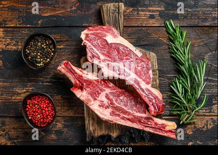 Meat Prime Cuts On A Wooden Table Against A Dark Black Background Stock 