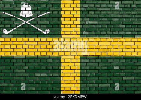 flag of Wreay painted on brick wall Stock Photo