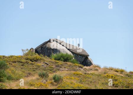 Beautiful stone Penedo Boulder House in Fafe, in Portugal Stock Photo