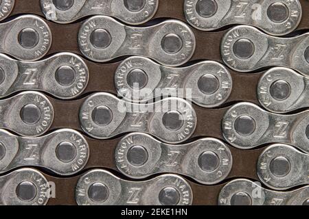 Krasnodar, Russia - February 12, 2021:New KMC bicycle chain for the whole frame. Background image Stock Photo