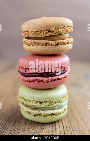 close up of fresh colorful macarons, raspberry, hazelnut, pistachio Stock Photo