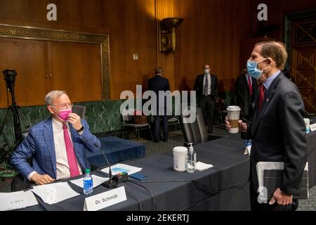 Dr. Eric E. Schmidt, Co-Founder, Schmidt Futures, left, is greeted by United States Senator Richard Blumenthal (Democrat of Connecticut) prior to a Senate Committee on Armed Services hearing to examine emerging technologies and their impact on national security, in the Dirksen Senate Office Building in Washington, DC, Tuesday, February 23, 2021. Credit: Rod Lamkey / CNP | usage worldwide Stock Photo