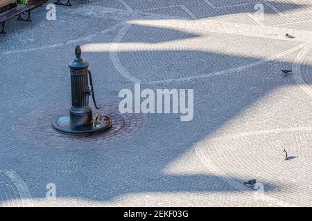 Warsaw, Poland old town market square historic cobblestone empty street during sunny day high angle view in town morning with pigeon birds and water d Stock Photo