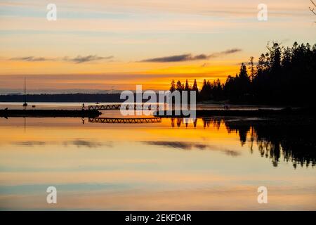 Silhouette of runner at Port Blakely Bridge at sunrise, Bainbridge Island, Washington, USA Stock Photo