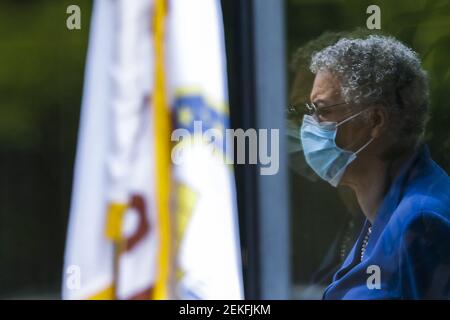 Cook County Board President Toni Preckwinkle is reflected in a window as she attends a news conference at the Cook County medical examiner's office in Chicago in May. (Photo by Jose M. Osorio/Chicago Tribune/TNS/Sipa USA)