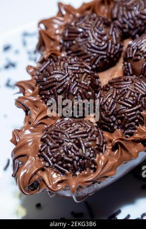 Brigadeiro chocolate easter egg in white plate background Stock Photo