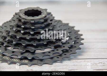 Krasnodar, Russia - February 12, 2021: Shimano bicycle cassette in black on a wooden background Stock Photo
