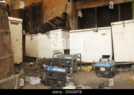 Calabar, capital of Cross River state, Nigeria. 23rd February 2021. Generators and refrigerators set at a trash dump site. A group of scavengers make their living from a trash dump, amidst wide spread of unemployment in Nigeria. Stock Photo