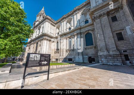 London, UK - June 26, 2018: St Paul's Cathedral side view wide angle exterior architecture with sign in downtown historic city Stock Photo