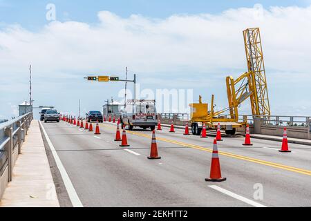 Bal Harbour, USA - May 8, 2018: Miami, Florida with Biscayne Bay Intracoastal water drawbridge on Broad Causeway with cars in traffic by stoplight Stock Photo