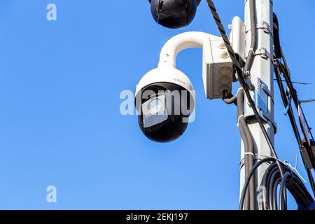 Samara, Russia - October 29, 2020: Surveillance CCTV cameras mounted on post against the blue sky Stock Photo