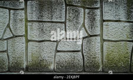 Mossy cracked old Stone wall texture Stock Photo