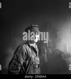 Welder employed in the Roundhouse at a Chicago and Northwestern Railroad Yard, Chicago, Illinois, USA, Jack Delano, U.S. Office of War Information, December 1942 Stock Photo