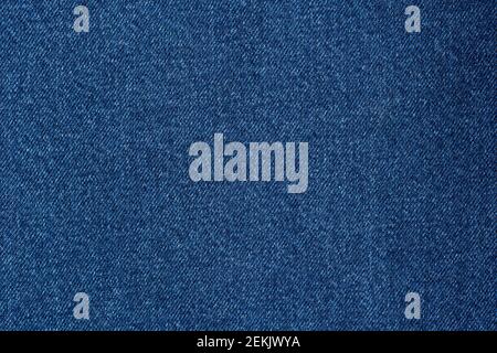 Denim blue jeans fabric. Denim background texture for design. Canvas denim. Blue jeans texture for any background. Stock Photo