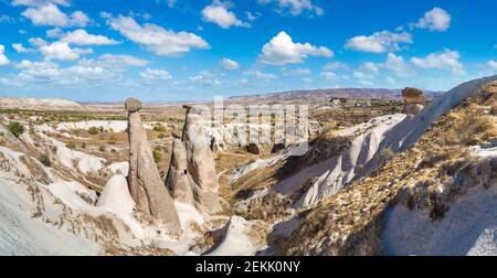 Three Graces (Three Beautifuls) rock hills in Devrent valley in Cappadocia, Nevsehir, Turkey in a beautiful summer day Stock Photo
