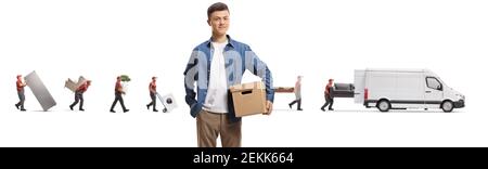 Movers putting household items in a white van and young guy holding a cardboard box in the front isolated on white background Stock Photo