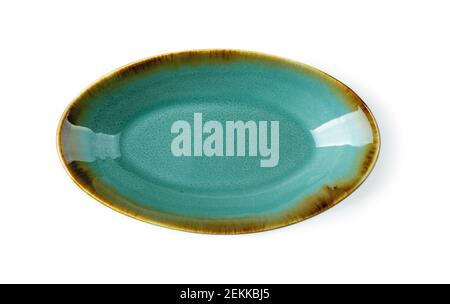 Top view of oblong turquoise ceramic plate isolated on a white background. Empty crockery for food design. Modern stylish dishes and tableware. Stock Photo