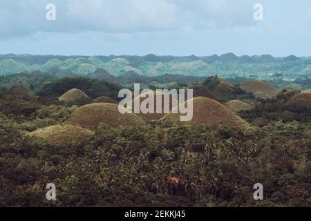 Chocolate Hills with a group of clouds in the sky Stock Photo