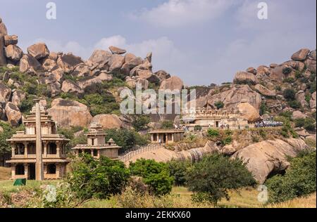 Chitradurga, Karnataka, India - November 10, 2013: Fort or Elusuttina Kote. Hidambeswara Temple ruinous buildings under blue sky with green foliage an Stock Photo