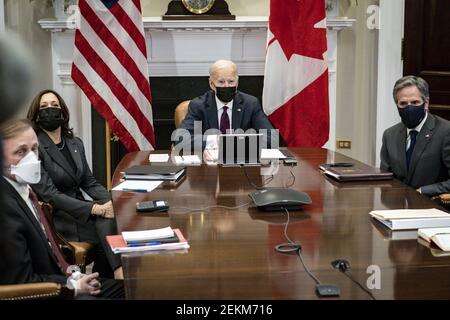 Washington, United States. 23rd Feb, 2021. Vice President Kamala Harris (left), President Joe Biden (center) and US Secretary of State Tony Blinken (right) participate in a virtual bilateral meeting with Prime Minister Justin Trudeau of Canada in the Roosevelt Room of the White House in Washington, DC, on Tuesday, February 23, 2021. Pool Photo by Pete Marovich/UPI Credit: UPI/Alamy Live News Stock Photo