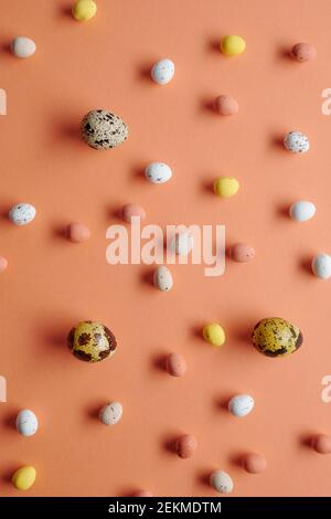 Image of painted big and small eggs for Easter isolated on orange background Stock Photo