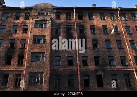 Facade of abandoned rmulti-storey building after fire Stock Photo