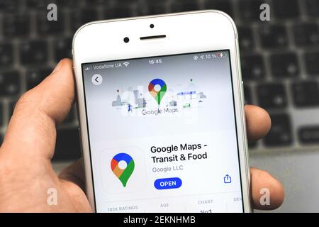 Kharkov, Ukraine - February 22, 2021: Google Maps is popular navigation mobile app, close up in man hand Stock Photo