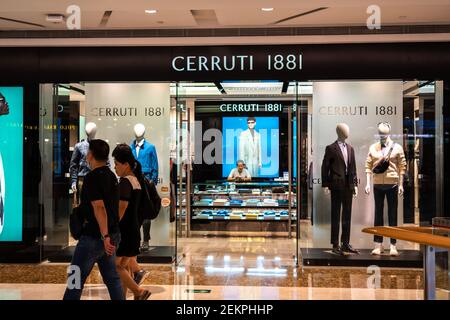 Pedestrians walk past a Cerruti 1881 store. Photo by Alex Tai