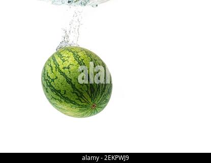 Watermelon splash and sinking isolated against white background Stock Photo