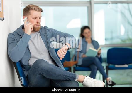 people sitting in waiting room Stock Photo
