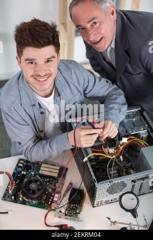 happy and successful young computer engineer Stock Photo