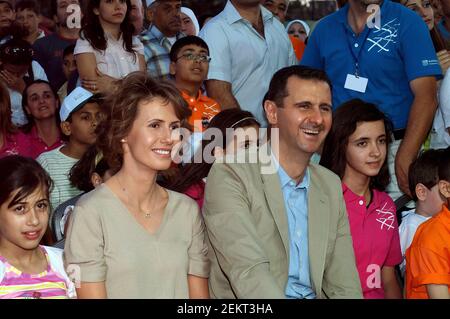 Syrian President Bashar Al Assad and the First lady, Asma Al Assad attend a charity event in Damascus. Stock Photo