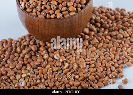 Organic lentils in spoon Isolated on a white background - close up shot Stock Photo