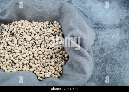 Raw white kidney beans on a gray background Stock Photo