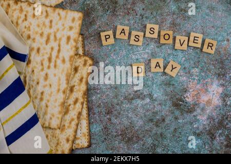 Passover celebrating of great Jewish family holiday symbols with kosher matzah traditional tallit Stock Photo