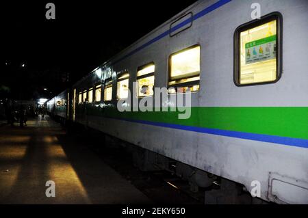 Burma local train stop wait burmese people and travelers passengers journey go to visit World Heritage Site night at railway station at Bagan or Pagan Stock Photo