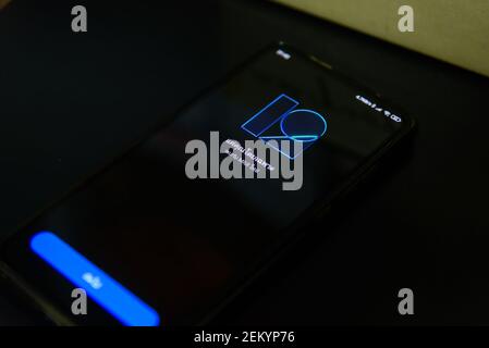 Rachaburi,Thailand - 21 February, 2021: Closeup focus to Smartphone model Mi9T updating MIUI android version 12 and Logo in reboot step Stock Photo
