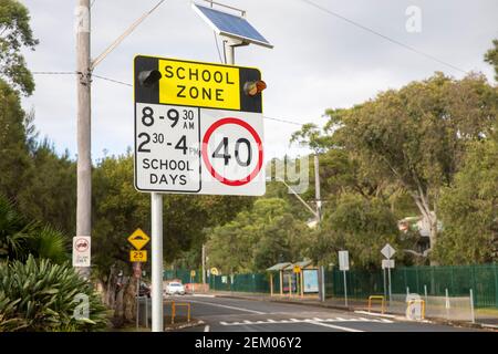 Australian school zone sign with 40 km speed limit and sign solar powered,Sydney,Australia Stock Photo