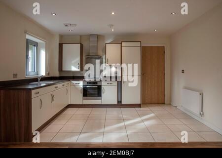 View of a kitchen area in a modern open plan apartment living area Stock Photo