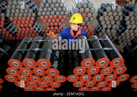 TONGCHENG, CHINA - NOVEMBER 17, 2020 - A worker carries out anti-corrosion treatment at the finished product area in the workshop of Anhui Climbing Heavy Industry Co., LTD in Tongcheng city, East China's Anhui Province, Nov. 17, 2020. (Photo by Jiang Sheng / Costfoto/Sipa USA)