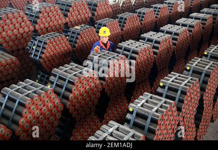TONGCHENG, CHINA - NOVEMBER 17, 2020 - A worker carries out anti-corrosion treatment at the finished product area in the workshop of Anhui Climbing Heavy Industry Co., LTD in Tongcheng city, East China's Anhui Province, Nov. 17, 2020. (Photo by Jiang Sheng / Costfoto/Sipa USA)