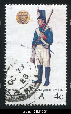 MALTA - CIRCA 1988: stamp printed by Malta, shows Coast Artillery Gunner, circa 1988 Stock Photo