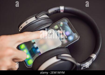 February 23, 2021, USA, New York: Clubhouse audio chat application view on the smartphone IPhone 12 pro. Clubhouse gained incredible popularity in Stock Photo