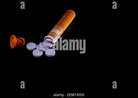 Selective focus on multivitamins effervescent tablets isolated on black. Bucharest, Romania, 2021 Stock Photo