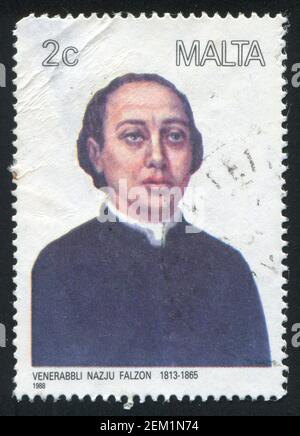 MALTA - CIRCA 1988: stamp printed by Malta, shows Clergyman Nazju Falzon, circa 1988 Stock Photo