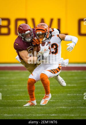 Landover, United States. 25th Oct, 2020. Dallas Cowboys quarterback Andy  Dalton (14) evades Washington Football Team linebacker Cole Holcomb (55)  during the first half of an NFL football game at FedEx Field